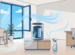 A clean office with an open window, fading odor wisps, and a compact air purifier.